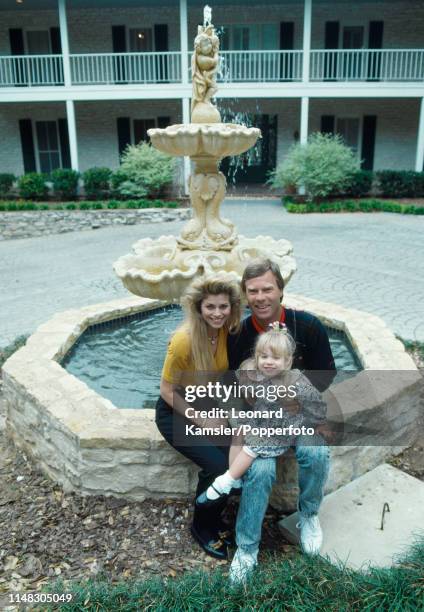 American golfer Ben Crenshaw with his wife Julie and daughter Katherine in front of their home in Austin, Texas, circa 1989.