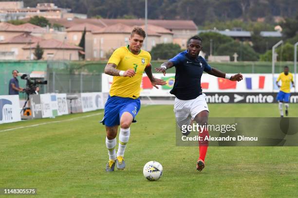 Lyanco Evangelista of Brazil and Ulrick Brad Eneme Ella of France during the Maurice Revello Toulon Tournament match between France and Brazil on...
