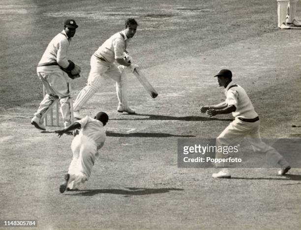 Everton Weekes fails to catch Denis Compton in the slips off Alfred Valentine during the 4th Test match between England and the West Indies at the...