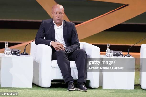 Mikael Silvestre, former football player and FIFA legend, speaks on stage during the FIFA Women's Football Convention at the Paris Expo Porte de...