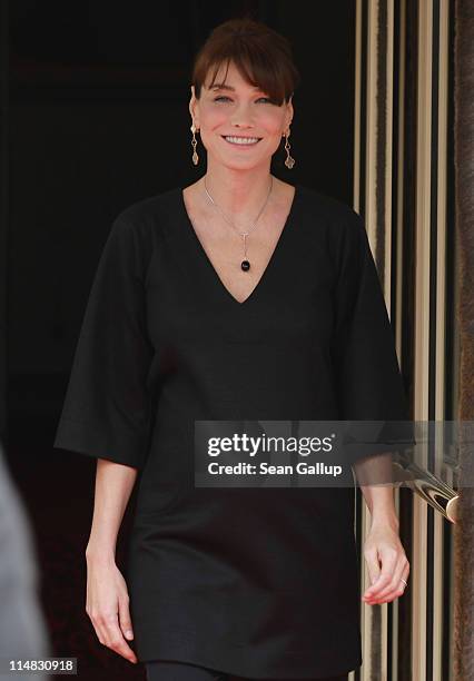 French First Lady Carla Bruni-Sarkozy, who is pregnant, stands outside Le Ciro's Resaturant before lunch with the spouses of heads of state on the...