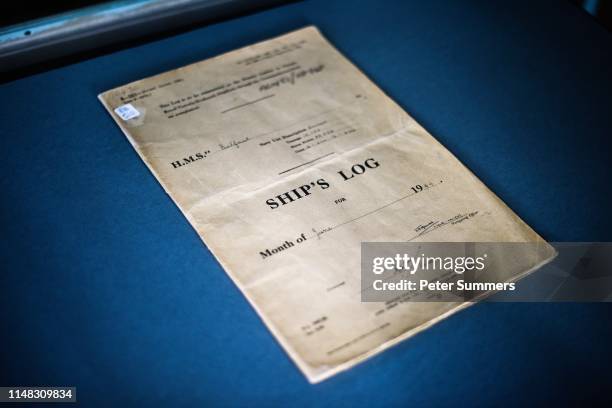 Belfast's logbook at HMS Belfast on June 6, 2019 in London, England. D-Day veterans from Blind Veterans UK were onboard the ship to mark a ceremony...