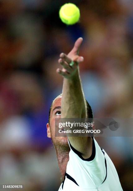 Xavier Malisse of Belgium, eyes the ball as he serves to Karol Kucera of the Slovak Republic, during the Hopman Cup in Perth, 05 January 2004....