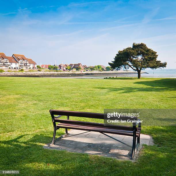 park bench on grass - hythe stock-fotos und bilder