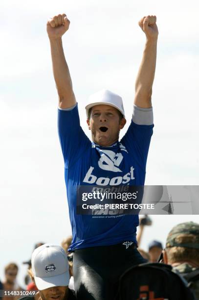 Richard Lovett celebrates on the shoulders of his friends after clinching the Boost Mobile Pro title at Lower Trestles, CA, 08 September 2003. Lovett...