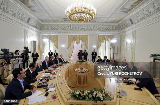 Russian President Vladimir Putin meets with heads of international news agencies on the sidelines of the St. Petersburg International Economic Forum...