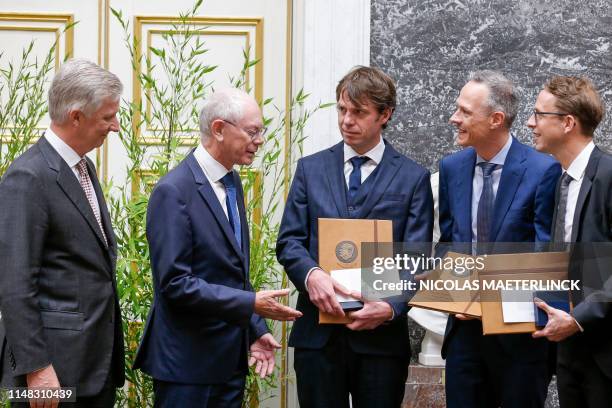 King Philippe of Belgium and former European Council President Herman van Rompuy award economists Laurens Cherchye , Bram De Rock and Frederic...