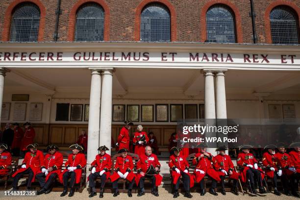 Chelsea Pensioners sit in the sun during the annual Founder's Day parade at Royal Hospital Chelsea on June 6, 2019 in London, England.