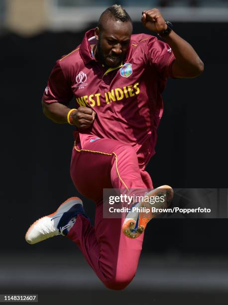 Andre Russell of the West Indies celebrates after dismissing Usman Khawaja of Australia in the pavilion before the ICC Cricket World Cup Group Match...