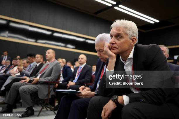 Oleg Tinkoff, chairman of Tinkoff Bank Jsc., watches a panel session at the St. Petersburg International Economic Forum in St. Petersburg, Russia, on...