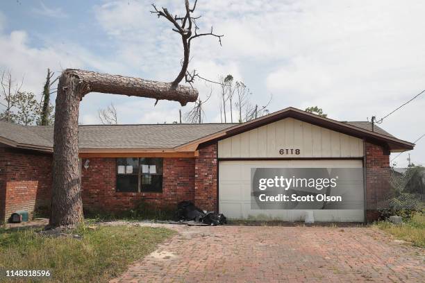 The roof is repaired but much of the tree that snapped during Hurricane Michael and damaged the home remains on May 10, 2019 in Panama City, Florida....