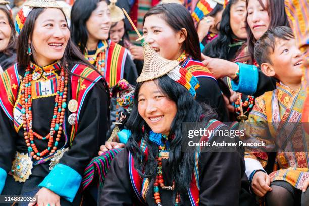 layap women at the gasa festival. the most distinctive feature of the layap women's dress is their conical hat. - bhutan stock pictures, royalty-free photos & images