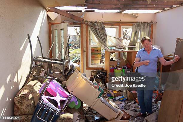 Shirley Bernings stands in what is left of her living room after the house was destroyed during a massive tornado on May 27, 2011 in Joplin,...