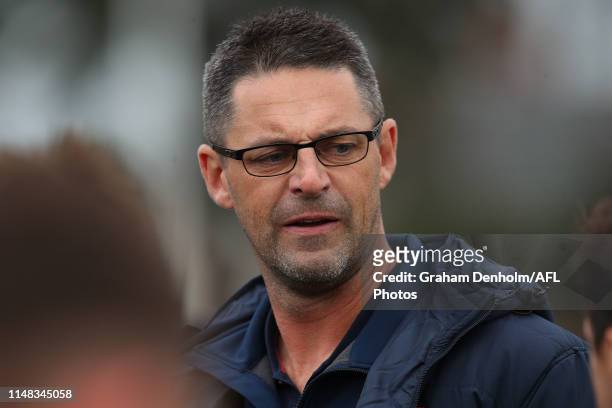 Casey Demons Head Coach Jade Rawlings talks to his players during the round six VFL match between Essendon and Casey at Windy Hill on May 11, 2019 in...