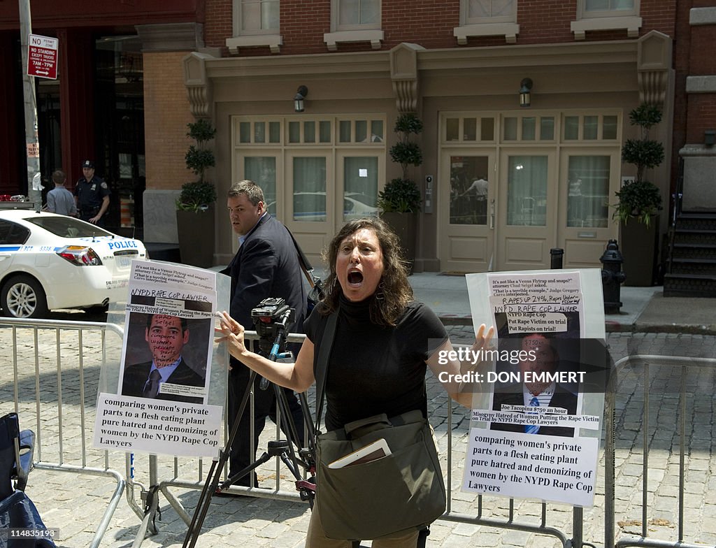 Suzannah Troy shouts in protest in front