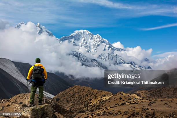 looking at the amazing view of  himalayas mountain. - mt everest base camp stock-fotos und bilder