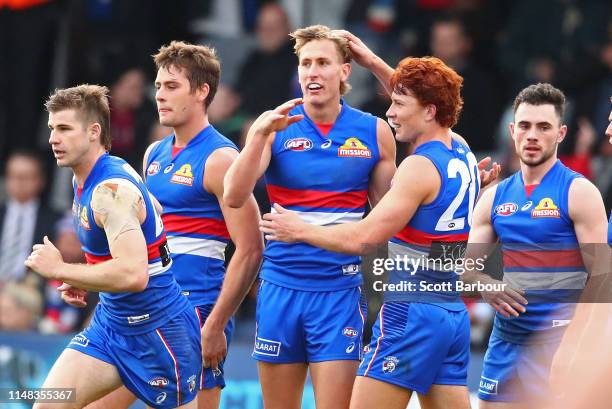 Aaron Naughton of the Bulldogs celebrates after kicking a goal with Ed Richards of the Bulldogs during the round eight AFL match between the Western...