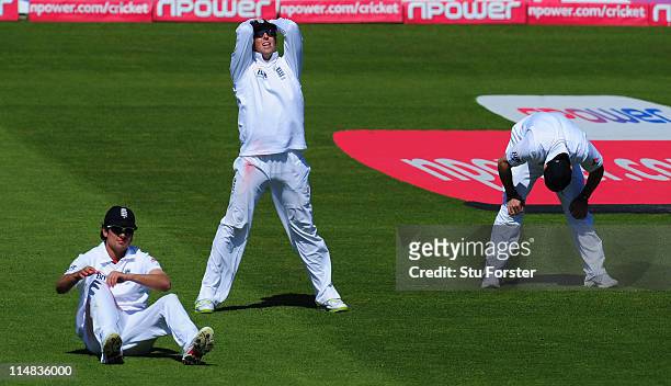 England fielders from left Alastair Cook; Graeme Swann and Andrew Strauss react after a near miss during day two of the 1st npower test match between...