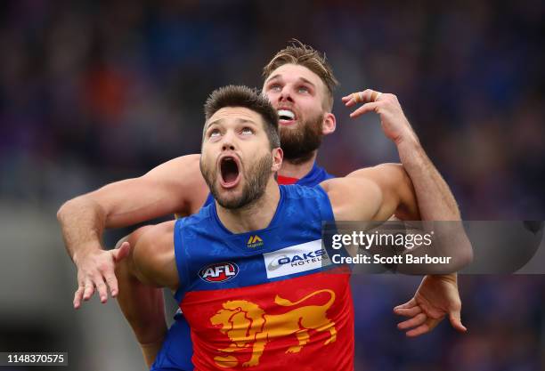 Stefan Martin of the Lions and Jackson Trengove of the Bulldogs compete for the ball during the round eight AFL match between the Western Bulldogs...