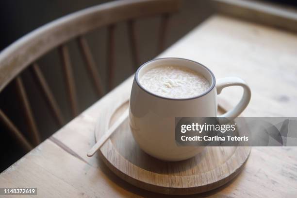 taiwanese almond oatmeal in a coffee cup - porridge stock pictures, royalty-free photos & images