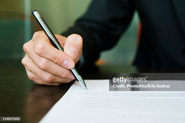 businessman signing paperwork, cropped - contract 個照片及圖片檔