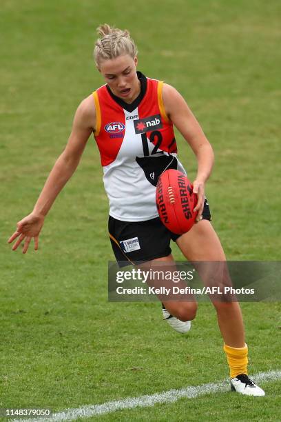 Molly McDonald of the Stingrays kicks the ball during the round nine NAB League girls match between the Western Jets and the Dandenong at Downer Oval...