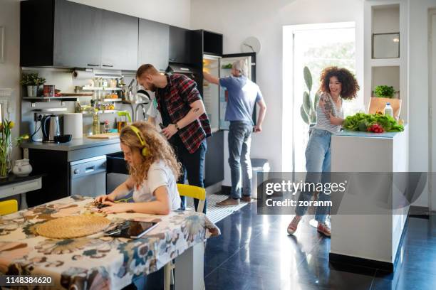 young flatmates working at home and having fun - open day 4 stock pictures, royalty-free photos & images