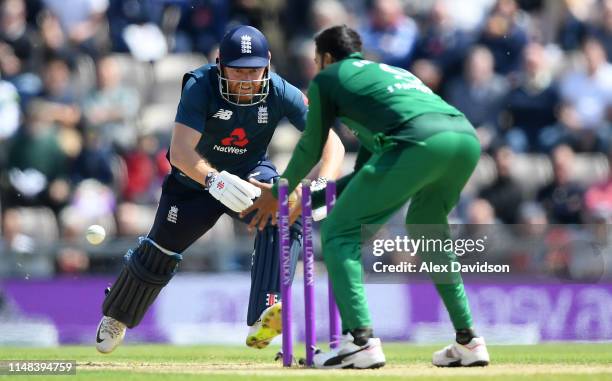 Imad Wasim of Pakistan hits the stumps while attempting to run out Jonny Bairstow of England during the second One Day International between England...