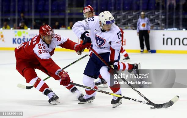 Oliver Lauridsen of Denmark challenges Guillaume Leclerc of France during the 2019 IIHF Ice Hockey World Championship Slovakia group A game between...