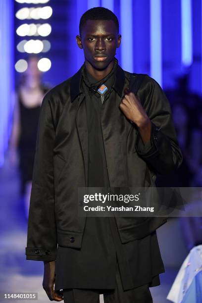 Model showcases designs on the runway during the Prada Spring / Summer 2020 Menswear Fashion Show on June 6, 2019 in Shanghai, China.