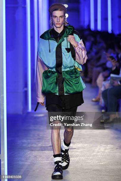 Model showcases designs on the runway during the Prada Spring / Summer 2020 Menswear Fashion Show on June 6, 2019 in Shanghai, China.