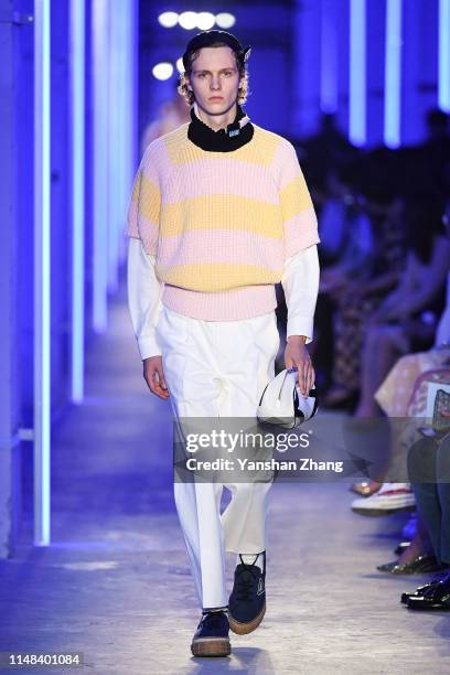 Model showcases designs on the runway during the Prada Spring / Summer 2020 Menswear Fashion Show on June 6, 2019 in Shanghai, China.