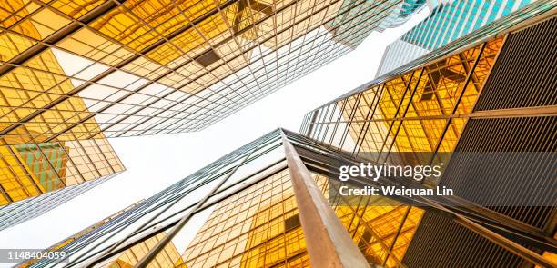 look up at the city buildings - buildings looking up stock pictures, royalty-free photos & images