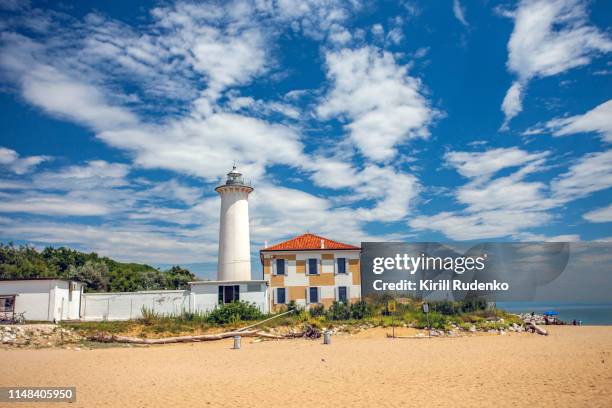 lighthouse on a bright sunny summer day. - bibione stock pictures, royalty-free photos & images