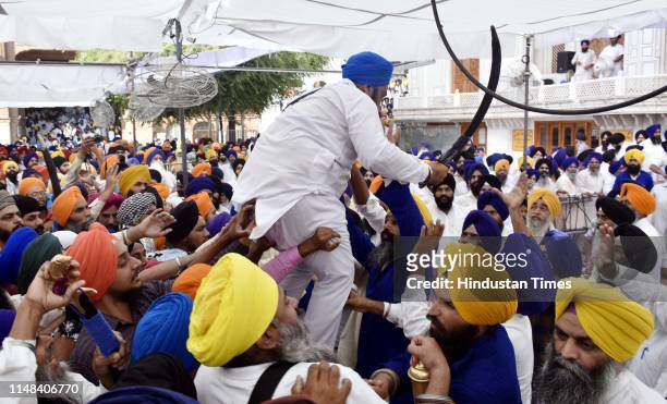 Members of various radical Sikh organisations clash with Shiromani Gurdwara Parbandhak Committee task force during a demonstration marking the 35th...