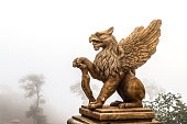 statue of Griffin or griffon a legendary creature with the body of a lion, the head and wings of an eagle