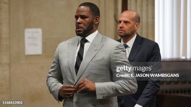 Kelly pleads not guilty to a new indictment before Judge Lawrence Flood at Leighton Criminal Court Building in Chicago on June 6, 2019. - R&B star R....
