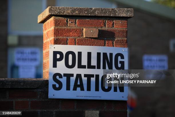 Sign is seen at The Christ the Carpenter church Hall polling station in Peterborough, England on June 6, 2019. - A local by-election was triggered...