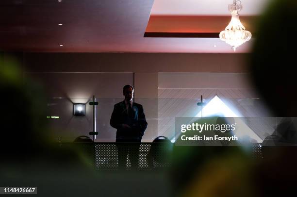 Brexit Party leader Nigel Farage waits to deliver his speech during a Brexit Party campaign at Rainton Meadows Arena on May 11, 2019 in Houghton Le...