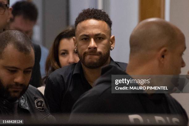 Brazil's star striker Neymar leaves a Police Station after giving a statement to police for posting intimate WhatsApp messages with Najila Trindade...