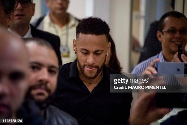 Brazil's star striker Neymar leaves a Police Station after giving a statement to police for posting intimate WhatsApp messages with Najila Trindade...