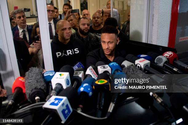 Brazil's star striker Neymar leaves a Police Station after giving a statement to police for posting intimate WhatsApp messages with Najila Trindade...