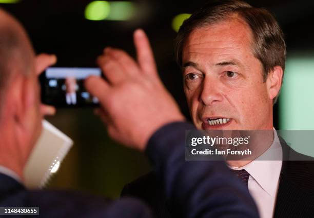 Brexit Party leader Nigel Farage speaks to journalists during a Brexit Party campaign event at Rainton Meadows Arena on May 11, 2019 in Houghton Le...