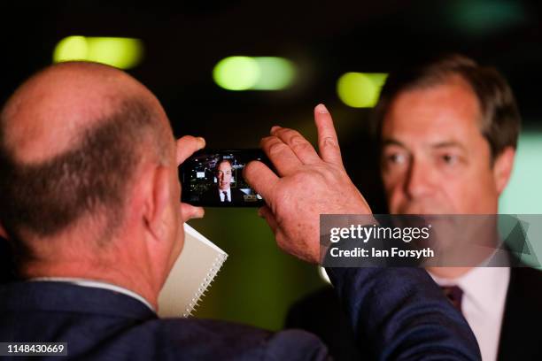 Brexit Party leader Nigel Farage speaks to journalists during a Brexit Party campaign event at Rainton Meadows Arena on May 11, 2019 in Houghton Le...
