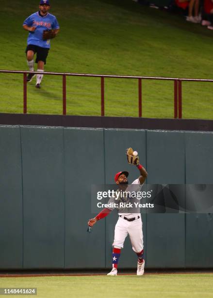 Delino DeShields of the Texas Rangers fields a fly ball in the sixth inning against the Baltimore Orioles at Globe Life Park in Arlington on June 6,...