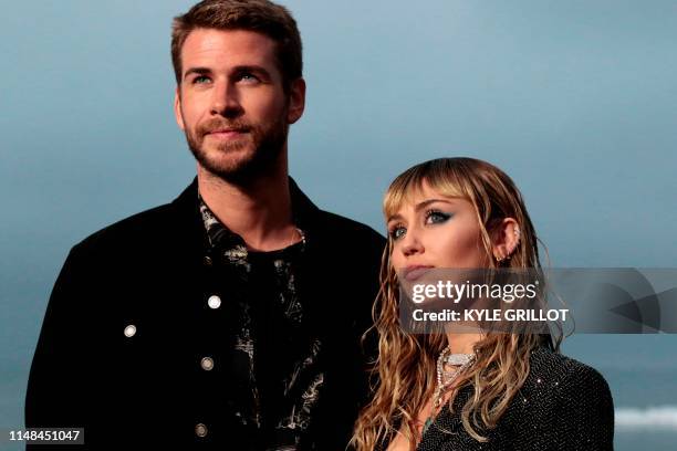 Singer Miley Cyrus and husband Australian actor Liam Hemsworth arrive for the Saint Laurent Men's Spring-Summer 2020 runway show in Malibu,...