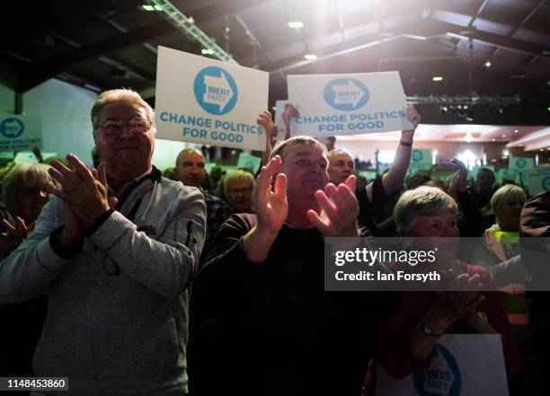 Brexit Party supporters react to speeches during a Brexit Party event at Rainton Meadows Arena in Houghton Le Spring on May 11, 2019 in Durham,...