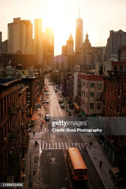 view from above of road intersection in chinatown at twilight. manhattan, new york city, usa - nyc building sun ストックフォトと画像