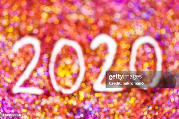 2020 happy new year background multicoloured  glitter - 2020 vision stock pictures, royalty-free photos & images