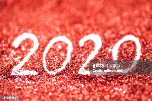 2020 happy new year background red glitter - 2020 vision stock pictures, royalty-free photos & images